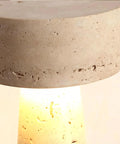 Close-up of Travertine Stone Table Lamp With Warm White LED, showing unique veining and glow on Japanese Wabi Sabi Mushroom design.