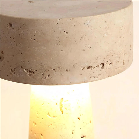 Close-up of Travertine Stone Table Lamp With Warm White LED, showing unique veining and glow on Japanese Wabi Sabi Mushroom design.
