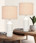 White Ceramic Table Lamps Set Of 2 For Living Room And Bedroom, Farmhouse Nightstand Lamps With Drum Lampshades, 24.25 Inch Tall, Wave Relief Bases shown on wooden tables.