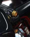 Close-up of Top Shelf Titanium Handlebar Clamp Bolts And Brake Clutch Perch Screws For Heavy Duty Motorcycles on a motorcycle handlebar.
