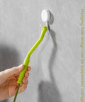 Flexible Drain Snake For Kitchen Sink And Bath Plumbing Portable Bendable Pipe Cleaner Spiral Design, shown hanging on a wall.