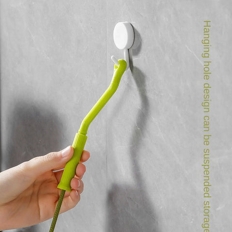 Flexible Drain Snake For Kitchen Sink And Bath Plumbing Portable Bendable Pipe Cleaner Spiral Design, shown hanging on a wall.