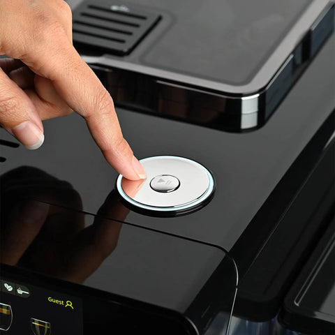 Close-up of a hand pressing the button on the Top Notch Automatic Espresso And Coffee Machine With Built In Grinder And Smart Touchscreen.
