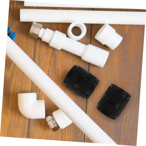 Two Piece Tubing Deburring Tools Reamers For Pipes Set on wooden surface with plumbing parts