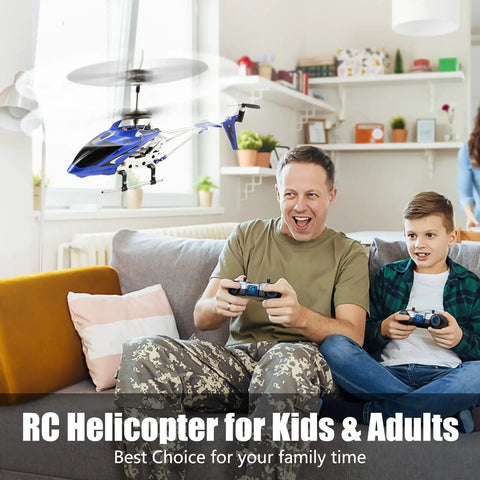 Father and son with controllers, flying a S107 S107G Phantom 3.5 Channel Mini RC Helicopter With Gyro Blue Indoor in living room.