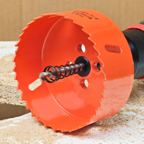 Koopi 3.25-inch bi-metal hole saw with arbor and drill bit; orange cutter with serrated teeth.