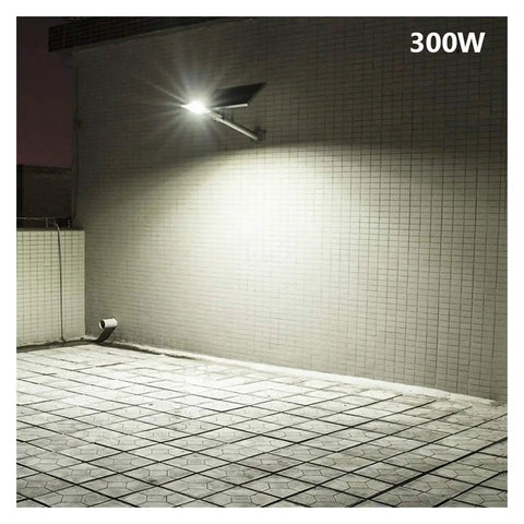 Zero Wire Headaches Solar Outdoor Flood Light With Smart Remote Heavy Duty IP65 Weatherproof Yard Lamp mounted on wall illuminating tiles.
