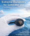 Marine RJ45 Ethernet cable, male-to-male, with black locking connector held by gloved hand against a sea background.