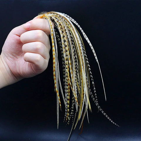 Hand holding Rooster Saddle Fly Tying Feathers Pack for Midge and Dry Fly Hackle, 9 to 11 inches, mixed colors, 10 feathers