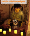 Child playing with dog surrounded by Flameless Votive Candles Set 2 Inch 24 Pack Battery Operated LED With Realistic Flicker Warm White