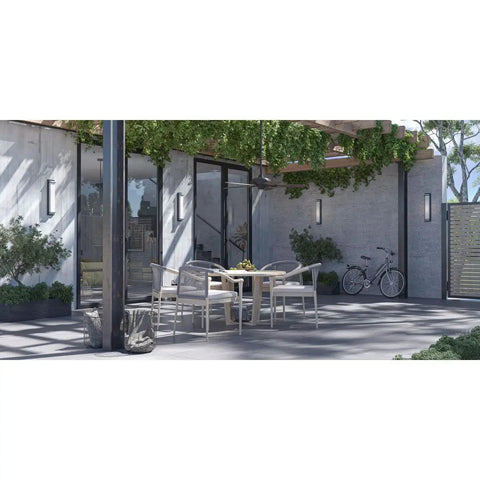 AirPro Collection 52 Inch Five Blade Indoor Outdoor Ceiling Fan on patio with tables and chairs, modern design