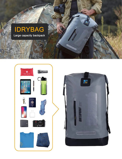 Man holding gray 20L Waterproof Dry Backpack For Men near camping tent, showcasing gear capacity and 500D PVC material.