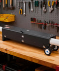 VEVOR Electric PVC Conduit Heater For 1/2 To 4 Inch Pipes With Rapid Even Heating Technology And Carry Handle on a workbench.