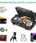 Open Portable Safe Box With 4 Digit Combination Lock holding cash, credit cards, passport, phone, watch, keys, and rings for travel security