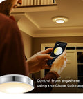 Person using phone app to control WiFi Smart Track Lighting Kit With Four 28W LED Fixtures, Matte Black, Voice Activated