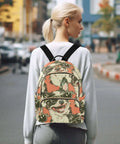 Woman wearing stylish backpack with dope pattern, leather handle, adjustable straps, multiple pockets; everyday carry bag.