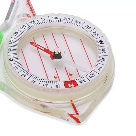 Close-up of thumb orienteering compass with luminous glow for easy one hand navigation, shockproof durability, quick needle lock.