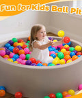 Child playing in a ball pit with Ball Pit Balls for Toddlers: 100 Colorful Non-Toxic Balls – BPA-Free, Phthalate-Free, 2.2 Inches