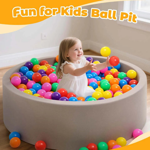 Child playing in a ball pit with Ball Pit Balls for Toddlers: 100 Colorful Non-Toxic Balls – BPA-Free, Phthalate-Free, 2.2 Inches