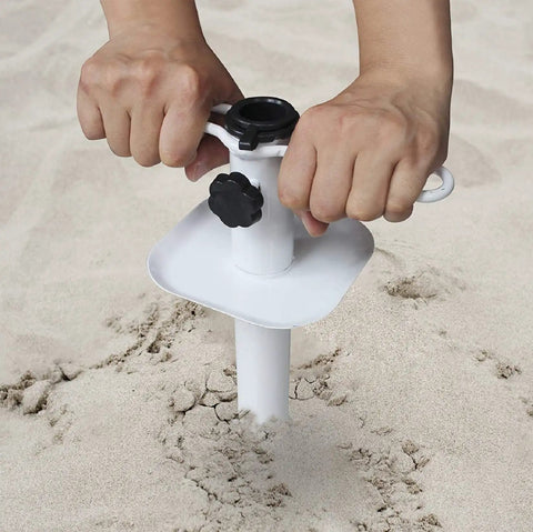 Hands installing Heavy Duty Beach Umbrella Sand Anchor Ground Screw Auger With Carry Bag Universal Fit For High Winds in sand