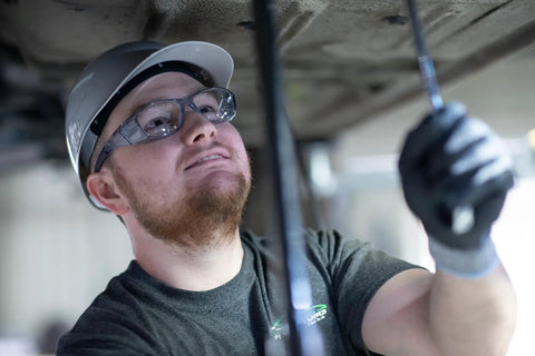 Worker wearing Emerge Plus Readers Safety Glasses With Rubber Nosepiece And Temple Tips Clear 1.5 Diopter Magnification
