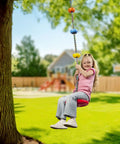 Child on Kids Tree Swing With Disc Seat And Rainbow Climbing Rope Set Including Carabiner And 2.6 Foot Strap in backyard