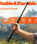Heavy Duty 27 Inch Gas Struts 45 Lbs For Truck Tonneau Cover, 2 Pack shown with a hand gripping a solid, durable strut in a scenic outdoor background.