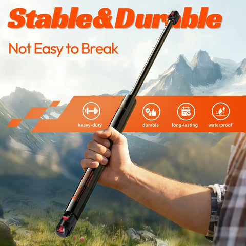 Heavy Duty 27 Inch Gas Struts 45 Lbs For Truck Tonneau Cover, 2 Pack shown with a hand gripping a solid, durable strut in a scenic outdoor background.