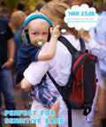 Kids Noise Cancelling Earmuffs With 25dB NRR Adjustable Headband Fireworks Pattern worn by toddler at outdoor event.