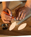 Real Deal Hardwood Biscuits 100 Pack Precision Joiner Slots Slick Fit No Fuss Cabinet Building Pro Shop Favorite For Furniture Crafting Smooth Finish Strong Hold; hands marking wood with joiner slots.