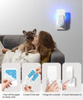 Woman relaxing on sofa with dog, Two Pack Plug In Flying Insect Trap Kit With Ten Refills Purple UV Light Bug Zapper plugged in.