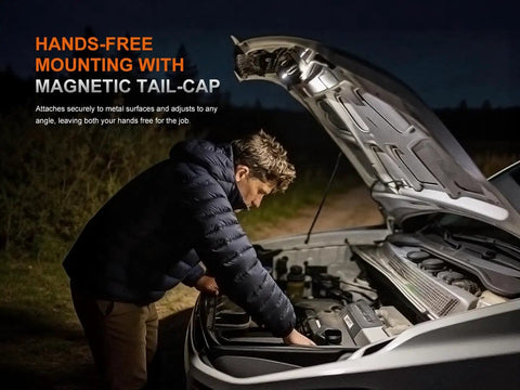 Person using Beast Mode 1200 Lumen Headlamp with magnetic tailcap for hands-free work under car hood at night.