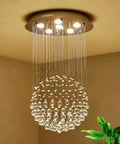 Lit Modern K9 Crystal Raindrop Chandelier Lighting Flush Mount LED Ceiling Light Fixture Pendant Lamp with circular crystals hanging.