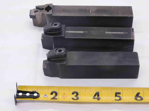 Three Piece Lathe Turning Tool Holder Set Featuring One Inch Square Shank, black steel tools, arranged with measuring tape.