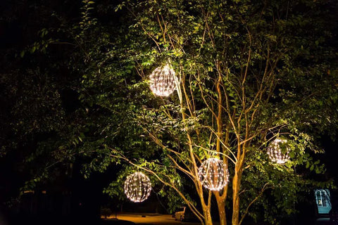 Trees adorned with 16 Inch LED Light Ball For Indoor And Outdoor Use With Warm White Lights Waterproof And Durable Lightweight Holiday Decor