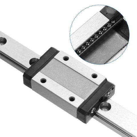Close-up of Two Pieces MGN9 400mm Linear Guide Rails With MGN9H Carriage Blocks and Plastic Mini MGN12 Guides for DIY 3D Printers and CNC Machines.