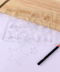 Kickass Star Router Jig Template Clear Hardened Acrylic Inlay Guide For Woodworking with star cutouts on paper.