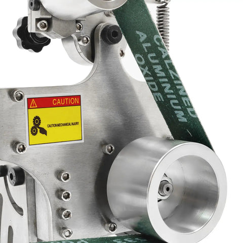 Close-up of Heavy Duty Bench Belt Sander 2X36 Inch showing aluminum oxide belt and caution label, used for woodworking and metal grinding.