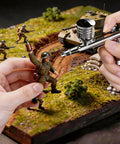 Pro Grade Airbrush Kit With Tough-Pressure Compressor, 55 Psi, used for model painting on miniature battlefield scene