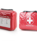 Front view of two red compact first aid kits in plastic wrap; left shows 228-piece contents label, right features a white cross.