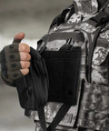 Person demonstrating Tactical EMT Pouch Upgrade IFAK Tear Away First Aid Kit attached to tactical vest.
