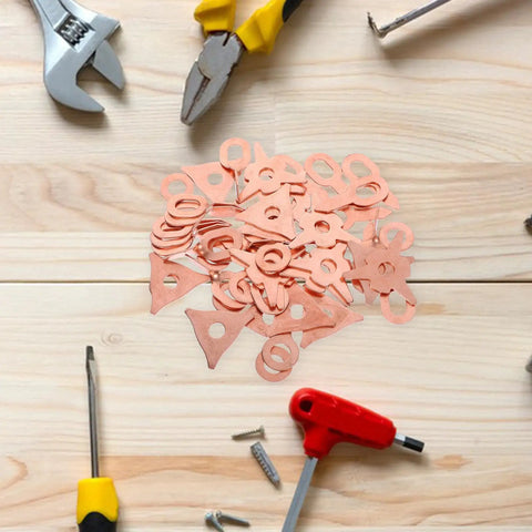Auto Dent Repair Kit with 50 dent puller rings and washers on wooden surface with tools