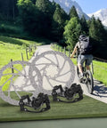 Smooth Mechanical Disc Brake Calipers Metal Pads For Ebike And Folding Bikes Featuring 180mm Front And 160mm Rear Rotors on display outdoors