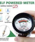 Close-up of All In One Soil PH Meter And Moisture Sensor with dial display, waterproof 295mm long metal electrode visible in use