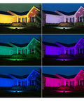 JUDYSSY Led RGB Flood Light 50W illuminating a house in different colors at night, showcasing RGB effects for outdoor spaces.