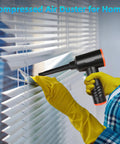 Person using Electric Air Duster With 6000mAh Battery 3 Speed LED Turbo Clean For Home Office Car Reusable Dust Blower on blinds