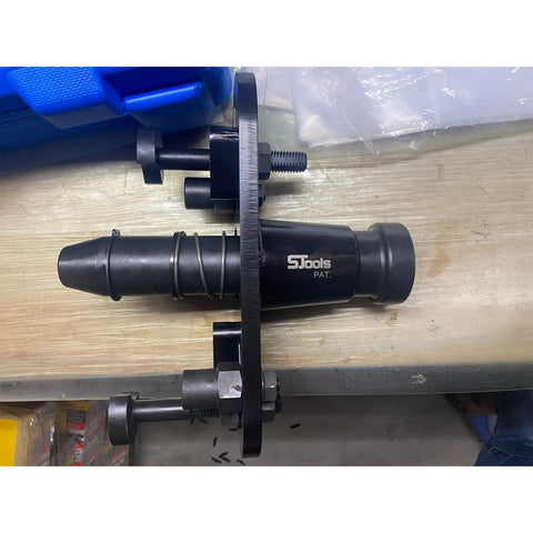 Heavy Duty Axle Shaft Puller Tool For Big Rig Trucks Featuring Quick Lock Adjustable Arms Secure Stud Chassis Mount and steady centered force.