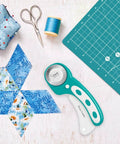 Headley Tools rotary cutter set with turquoise handle, 45mm blade, A3 cutting mat, quilting ruler and extra blades
