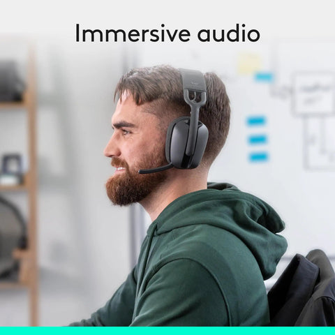 Person wearing Zone Vibe 100 Wireless Over Ear Headphones With Noise Canceling Microphone for All Day Work and Play in office.