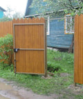Heavy Duty Cane Bolt And 18 Inch Drop Rod Kit Built Like A Tank With Black Powder Coating For Outdoor Wood Fence Gates on a wooden gate.